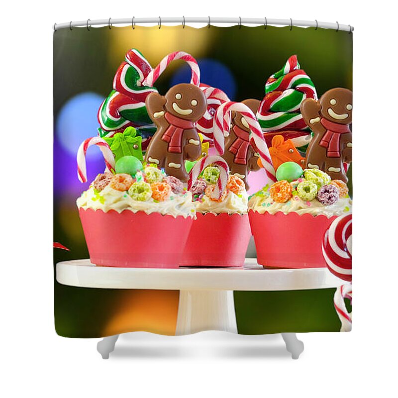 Christmas Shower Curtain featuring the photograph On trend candy land festive Christmas cupcakes. by Milleflore Images