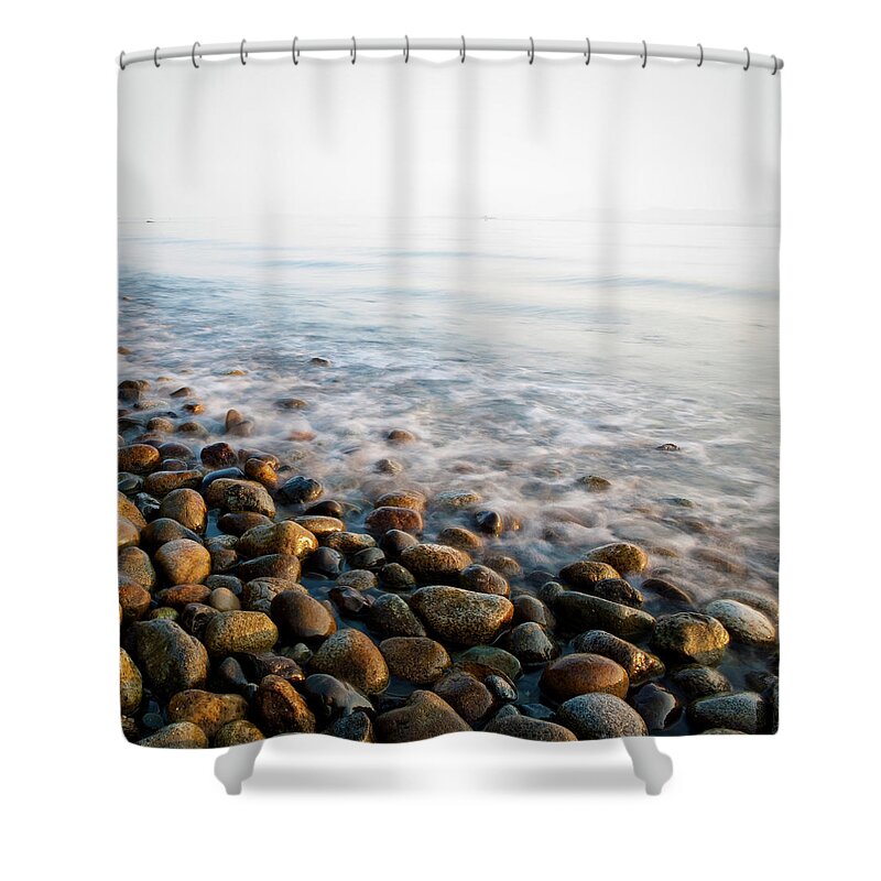 Sparse Shower Curtain featuring the photograph Pebble Rocks On Beach by Visualcommunications