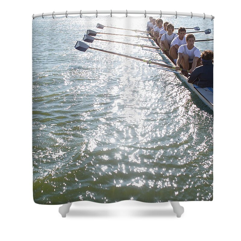Young Men Shower Curtain featuring the photograph People Sitting In A Row Oaring Boat by Clerkenwell