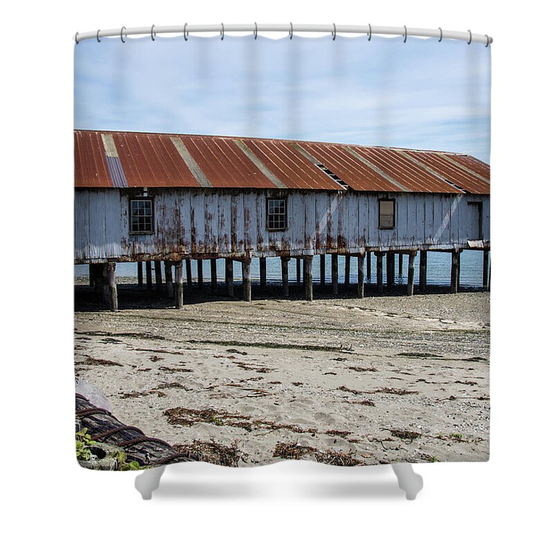 Pilings And Rusty Roof Shower Curtain featuring the photograph Pilings and Rusty Roof by Tom Cochran