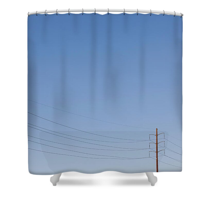 In A Row Shower Curtain featuring the photograph Power Lines Against A Clear Sky by Patrick Strattner