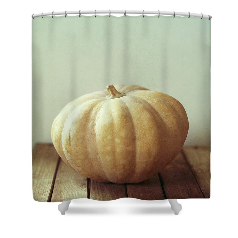 Wood Shower Curtain featuring the photograph Pumpkin On Wooden Table by Copyright Anna Nemoy(xaomena)