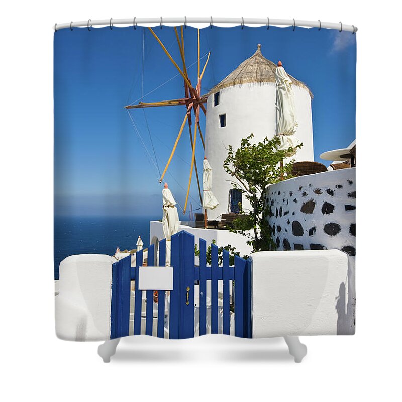 Architectural Feature Shower Curtain featuring the photograph Santorini Windmill With Blue Fence by Arturbo