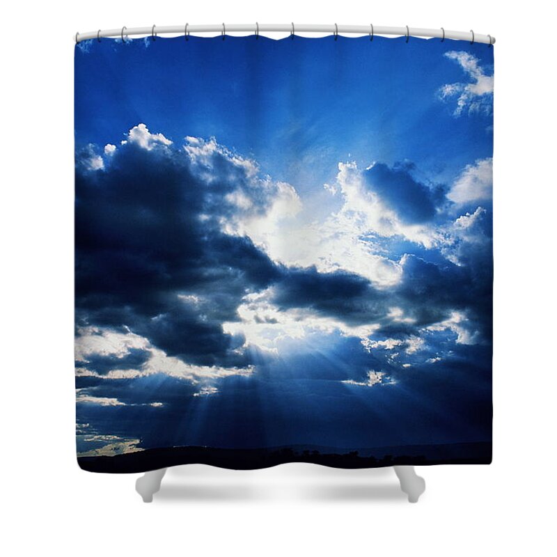 Scenics Shower Curtain featuring the photograph Shafts Of Sunlight From Behind Dark by Manoj Shah