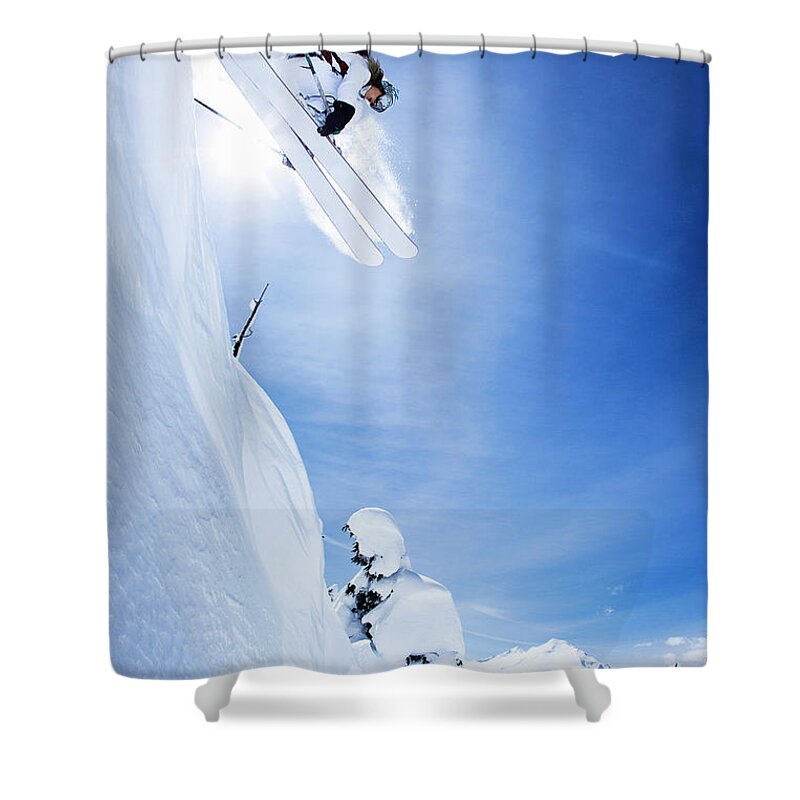 Ski Pole Shower Curtain featuring the photograph Skier Jumping On Snowy Slope by Jakob Helbig