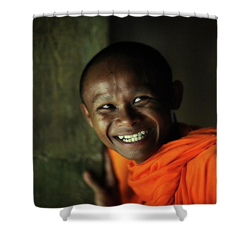 Orange Color Shower Curtain featuring the photograph Smiling Buddhist Monk At Angkor Wat by Timothy Allen