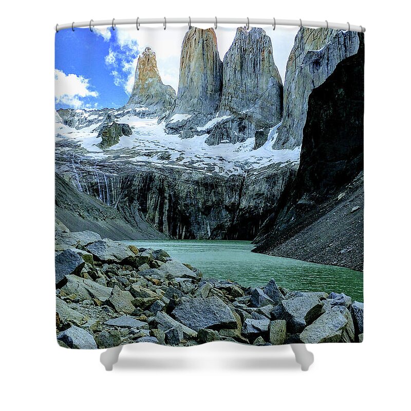 Torres Del Paine National Park Shower Curtain featuring the photograph The rugged windswept Towers over turquoise glacial water by Leslie Struxness