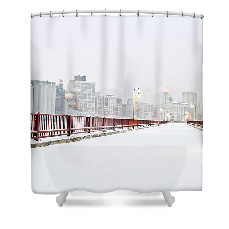 Snow Shower Curtain featuring the photograph The Stone Arch Bridge In Minneapolis by Adam Hester