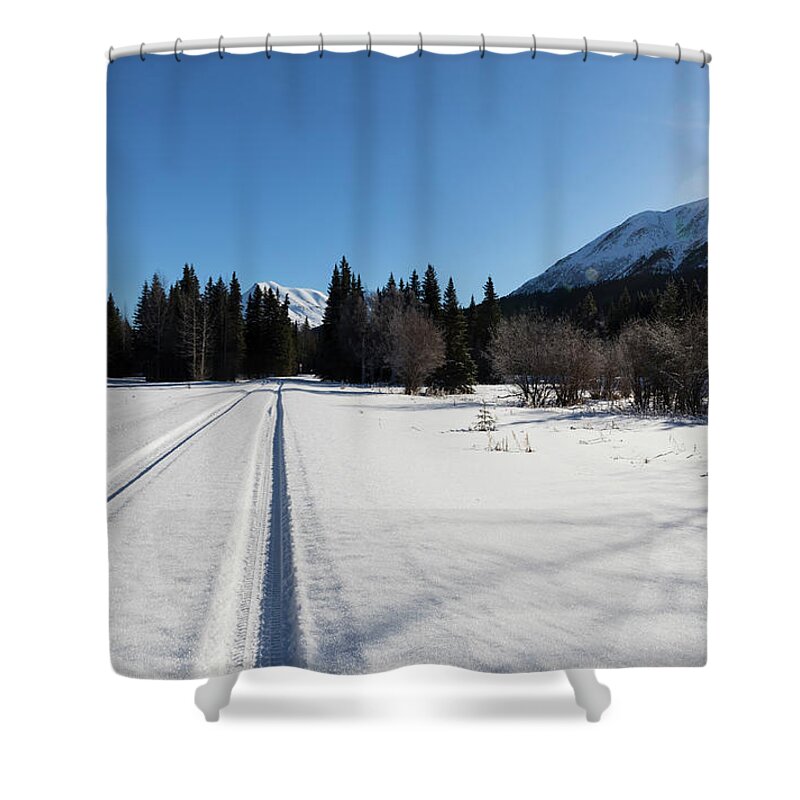Kenai Peninsula Shower Curtain featuring the photograph Tire tracks in snow in an isolated area of the Kenai Peninsula by Louise Heusinkveld