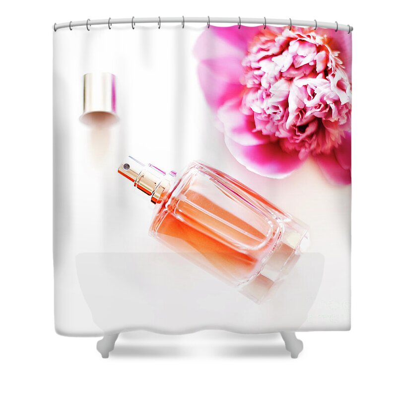 Perfume Shower Curtain featuring the photograph Top view of luxury perfume bottle and pink peony flower on white by Jelena Jovanovic