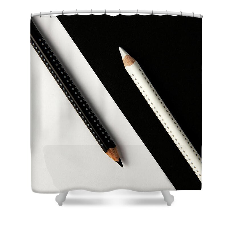 Pencil Shower Curtain featuring the photograph Two drawing pencils on a black and white surface. by Michalakis Ppalis