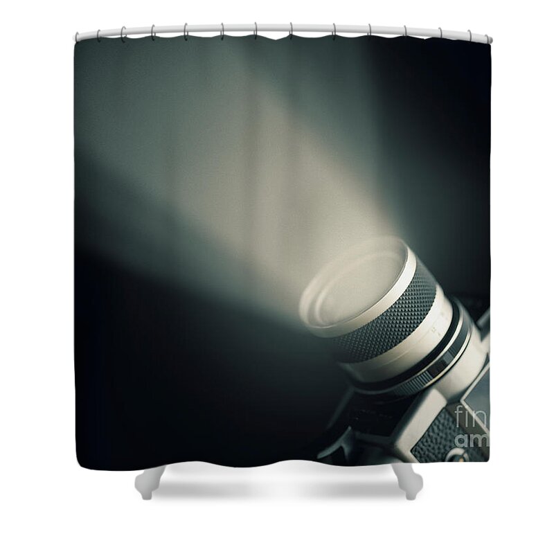 Camera Shower Curtain featuring the photograph Vintage film camera super 8mm with spotlight over black backgrou by Jelena Jovanovic