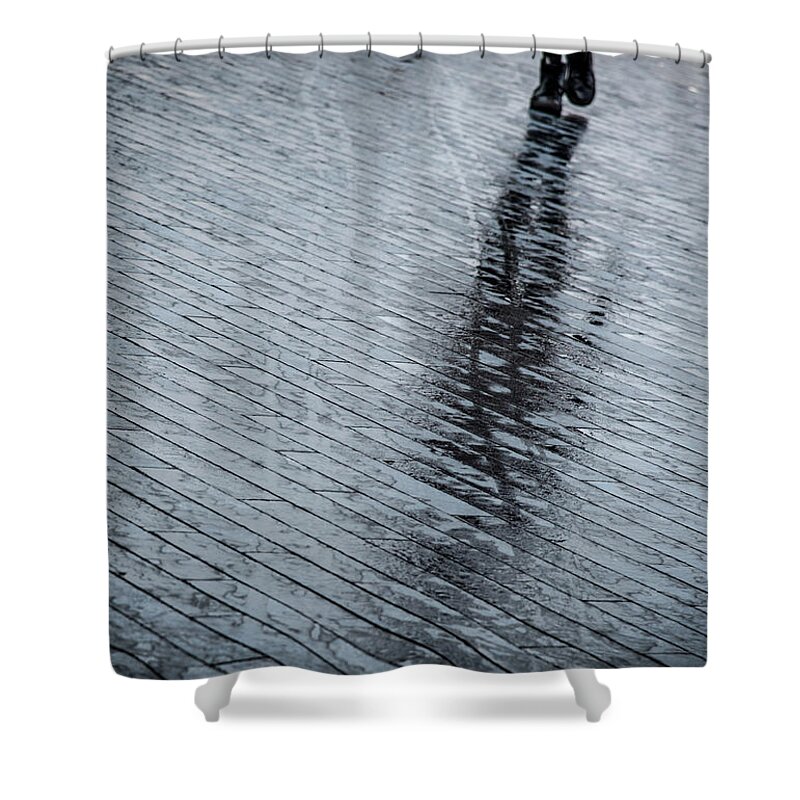 Silhouette Shower Curtain featuring the photograph Walking shadow of an unrecognised person walking on wet streets by Michalakis Ppalis