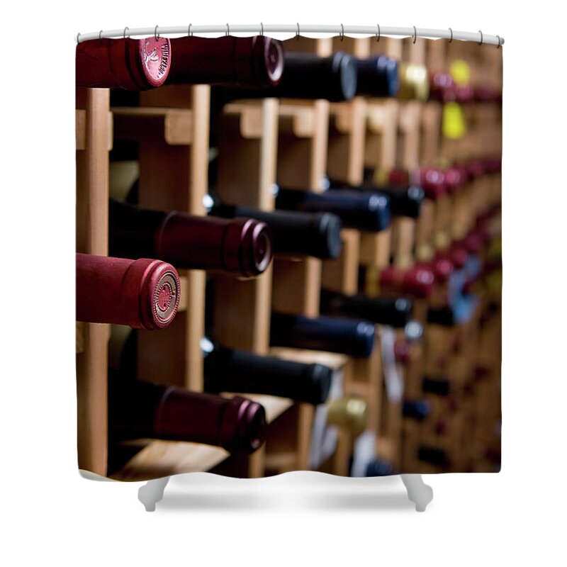 Alcohol Shower Curtain featuring the photograph Wine Bottles In Cellar by Markhatfield