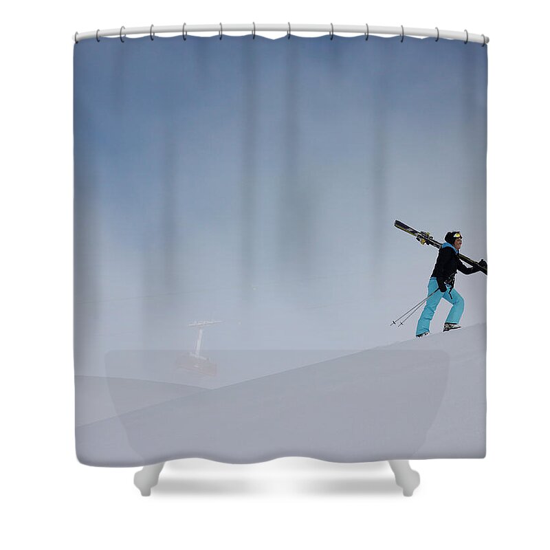 Ski Pole Shower Curtain featuring the photograph Woman Carrying Skis Walking Up Snow by Mel Yates