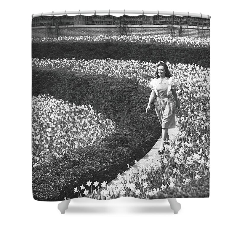 Flowerbed Shower Curtain featuring the photograph Woman Walking On Flowerbed, B&w by George Marks