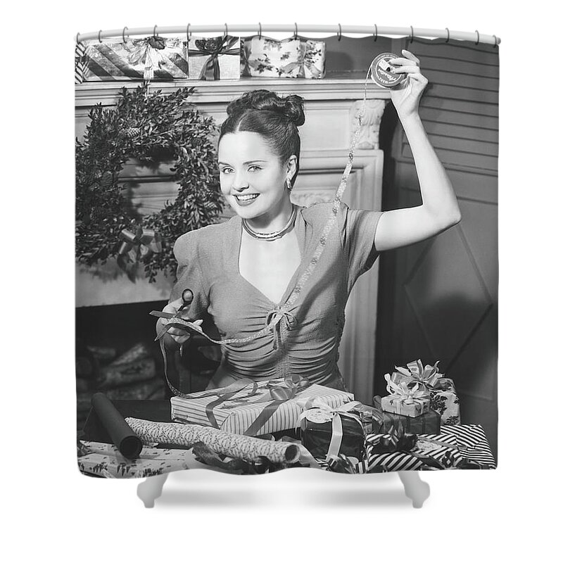 Human Arm Shower Curtain featuring the photograph Woman Wrapping Christmas Presents In by George Marks