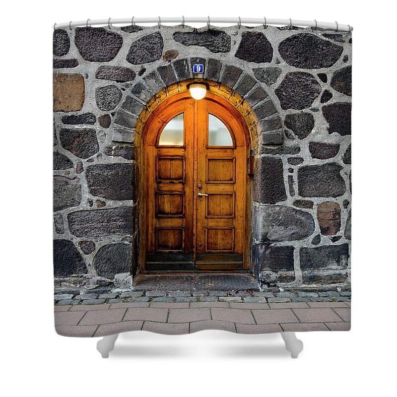 Arch Shower Curtain featuring the photograph Wooden Door In Illuminated Doorway, Set by Blackestockphoto