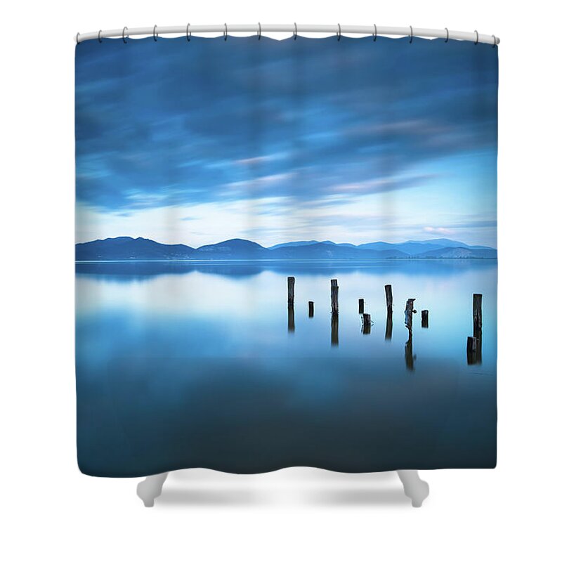 Lake Shower Curtain featuring the photograph Lake and Jetty Remains after Sunset by Stefano Orazzini