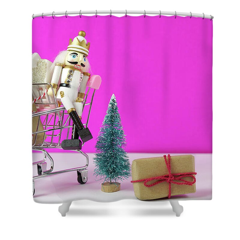 Christmas Shower Curtain featuring the photograph Shopping cart full of Christmas gifts, tree and nutcracker ornament. #1 by Milleflore Images