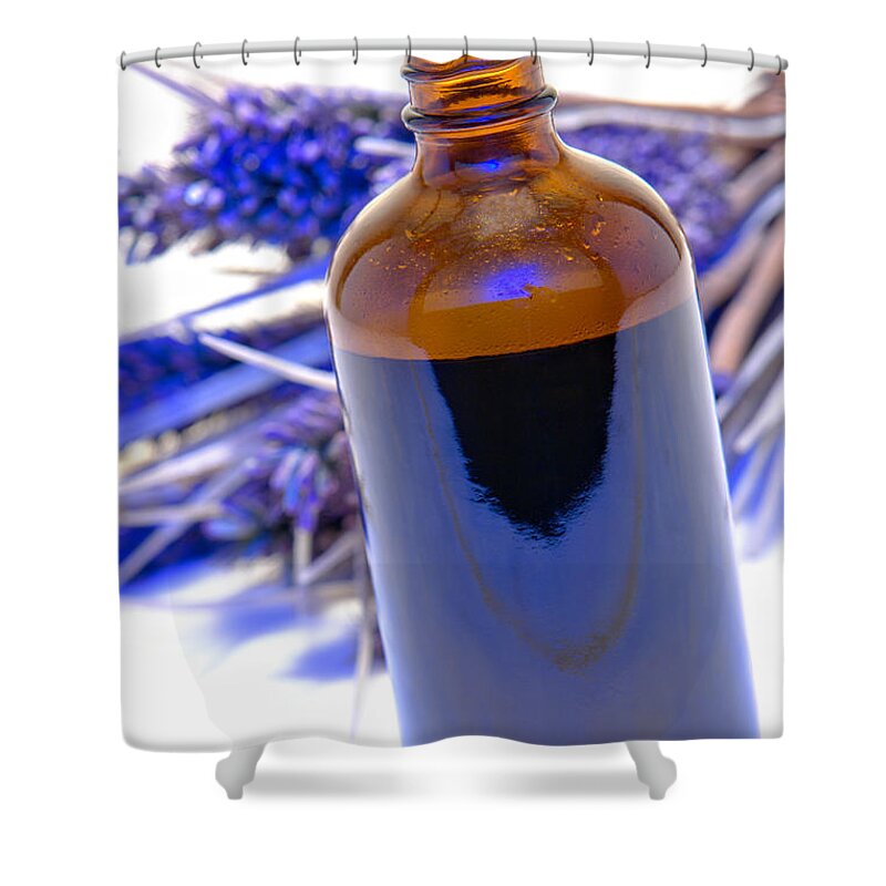 Aromatherapy Shower Curtain featuring the photograph Aromatherapy Bottle with Blue Flower Background by Olivier Le Queinec