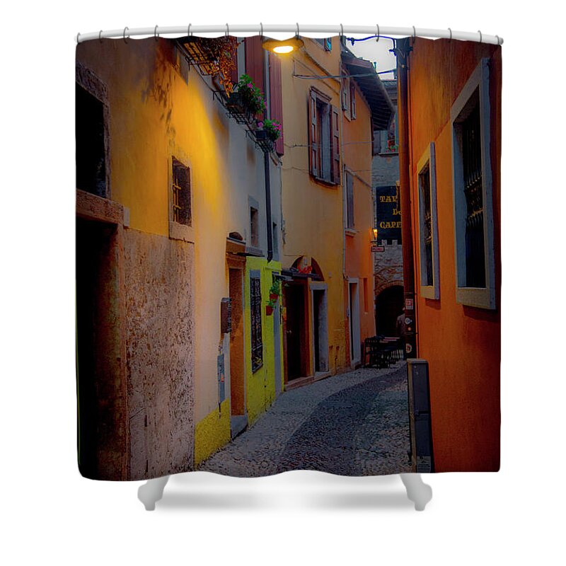 Tourism Shower Curtain featuring the photograph A Quiet Stroll in Malcesine by W Chris Fooshee