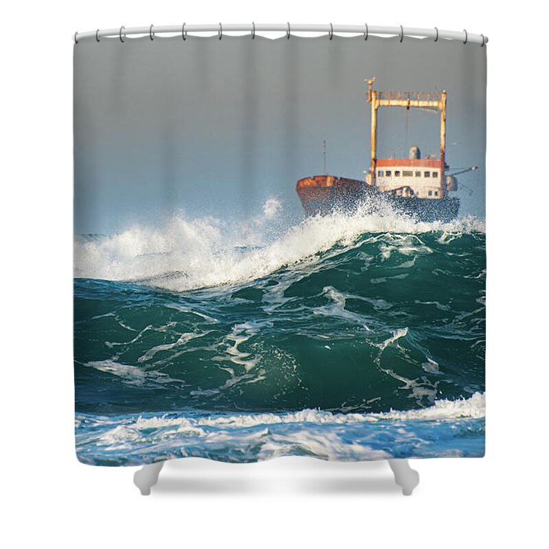 Shipwreck Shower Curtain featuring the photograph Abandoned ship in the stormy ocean by Michalakis Ppalis