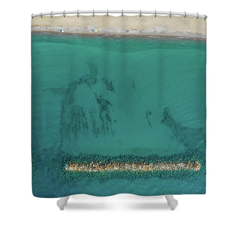 Beachfront Shower Curtain featuring the photograph Aerial view from flying drone of people relaxing on the beach. Paphos Cyprus by Michalakis Ppalis