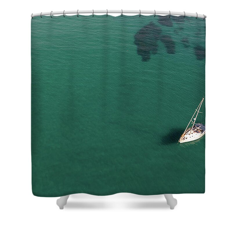 Anchored Shower Curtain featuring the photograph Aerial view of a luxury yacht anchored in the surface of the sea. Cyprus vacations by Michalakis Ppalis