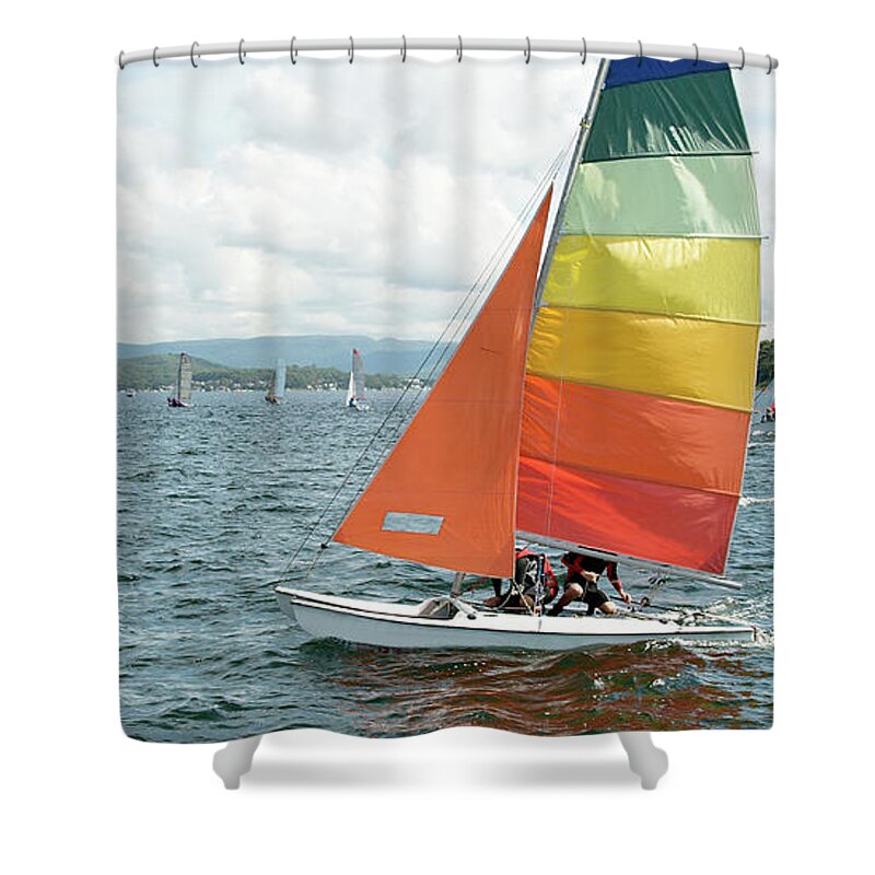 Csne26 Shower Curtain featuring the photograph Childern racing sailing a small catamaran sailboat with colourfu by Geoff Childs