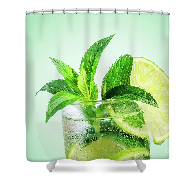 Mojito Shower Curtain featuring the photograph Closeup mojito cocktail with ice isolated over pastel background by Jelena Jovanovic