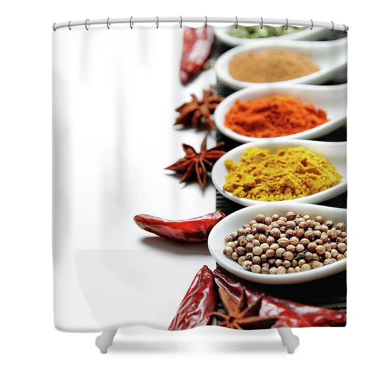 Spices Shower Curtain featuring the photograph Colorful spices in spoon on white background by Jelena Jovanovic
