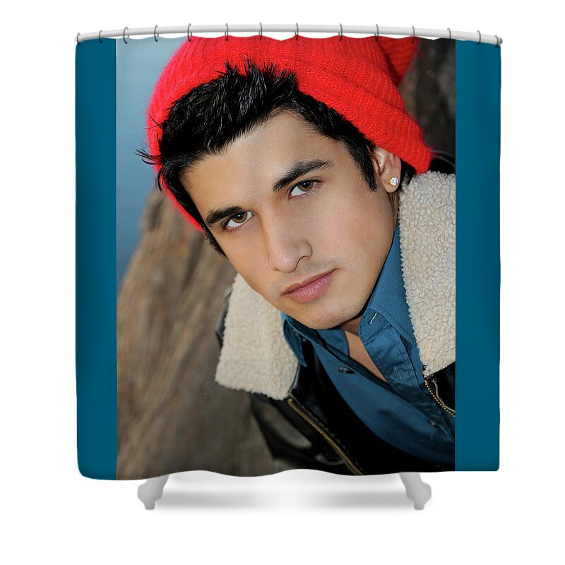 Face Shower Curtain featuring the photograph Handsome young hispanic man portrait wearing a red ski cap by Gunther Allen