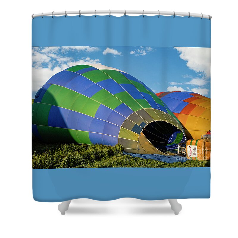 Balloon Shower Curtain featuring the photograph Hot air balloons filling up with hot air and getting ready to take off. by Gunther Allen