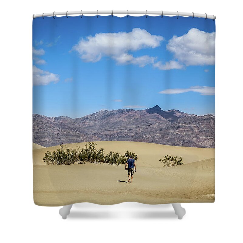 Death Valley Shower Curtain featuring the photograph Man hiking in Death Valley NP by Alberto Zanoni