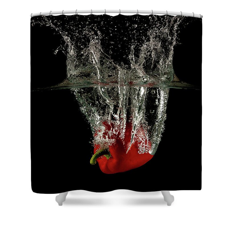 Pepper Shower Curtain featuring the photograph Red bell pepper dropped and slashing on water by Michalakis Ppalis