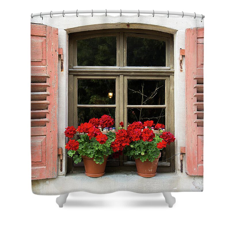 Window Shower Curtain featuring the photograph Red flowers and red shutters by Karen Kaspar