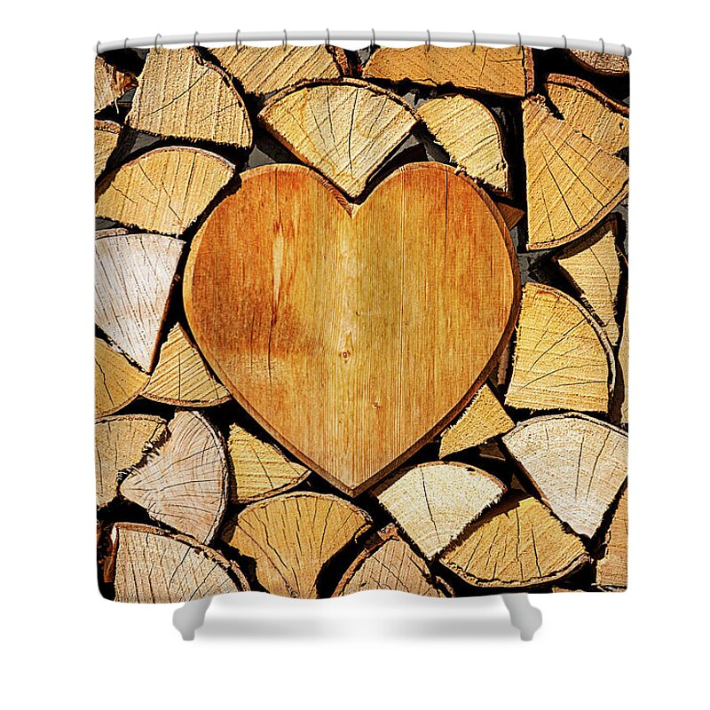 Pile Shower Curtain featuring the photograph Stack of firewood with a wooden heart by Bernhard Schaffer