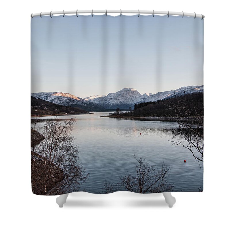Christmas Shower Curtain featuring the photograph The snowy hills are illuminated by the last vestige of orange sunlight. Narvik, Norway by Vaclav Sonnek