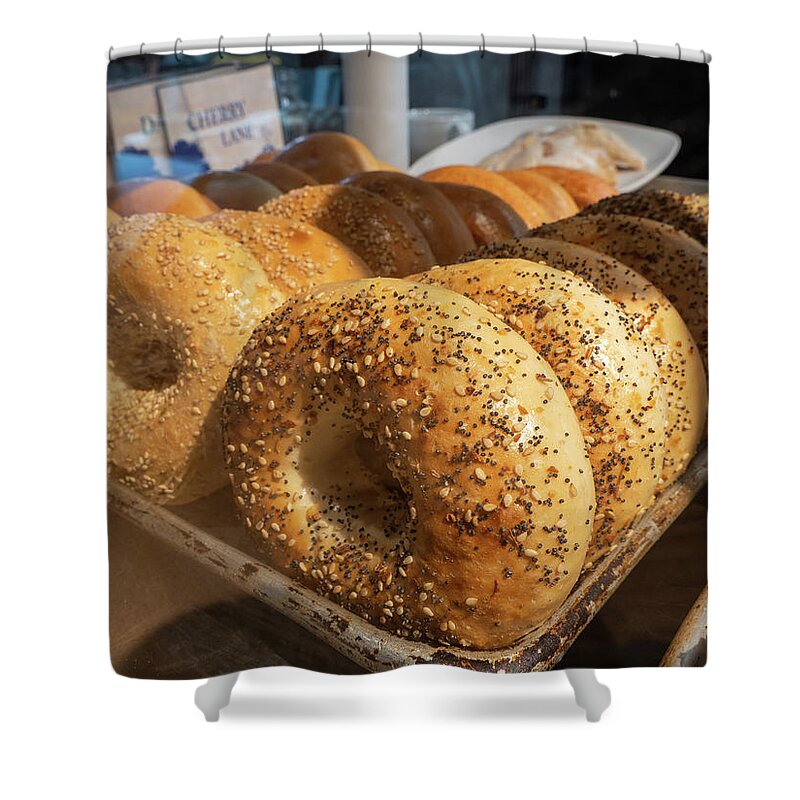 Appetizer Shower Curtain featuring the photograph Tray of bagels in a bakery. by Kyle Lee