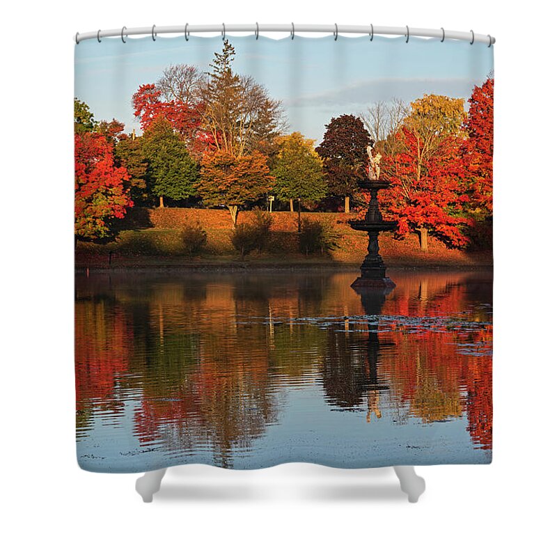 Newburyport Shower Curtain featuring the photograph Vibrant Fall Colors on the Newburyport Frog Pond Newburyport Massachusetts Fountain by Toby McGuire