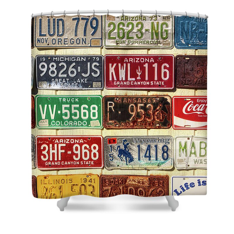 Antique Shower Curtain featuring the photograph Vintage license plates display by Tatiana Travelways