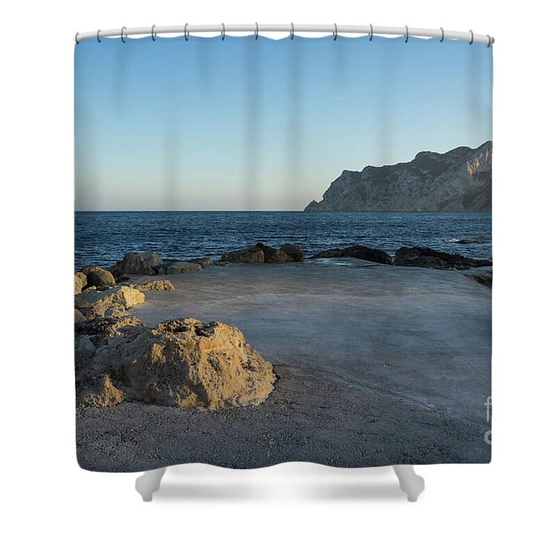 Mediterranean Coast Shower Curtain featuring the photograph Warm evening light meets deep blue by Adriana Mueller