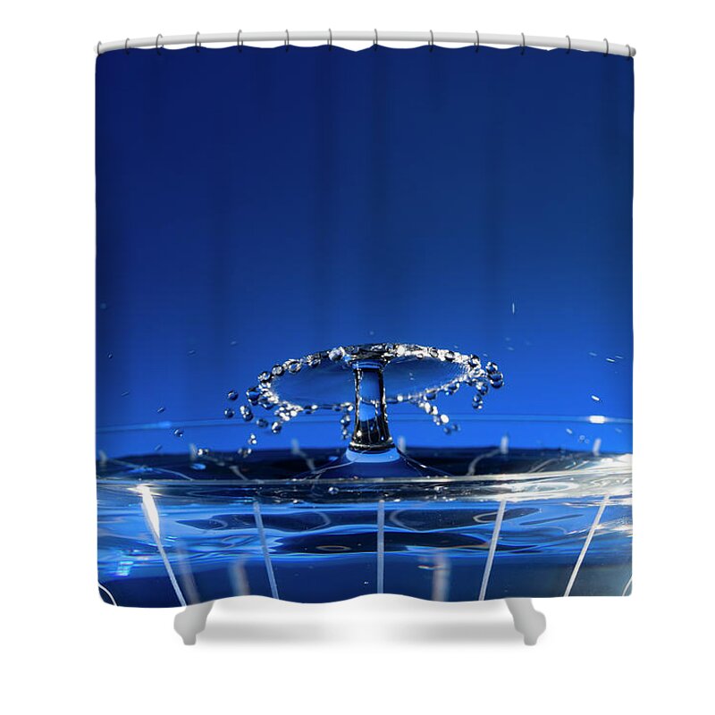 North Wilkesboro Shower Curtain featuring the photograph Water Drops Collide Over Martini Glass Blue by Charles Floyd