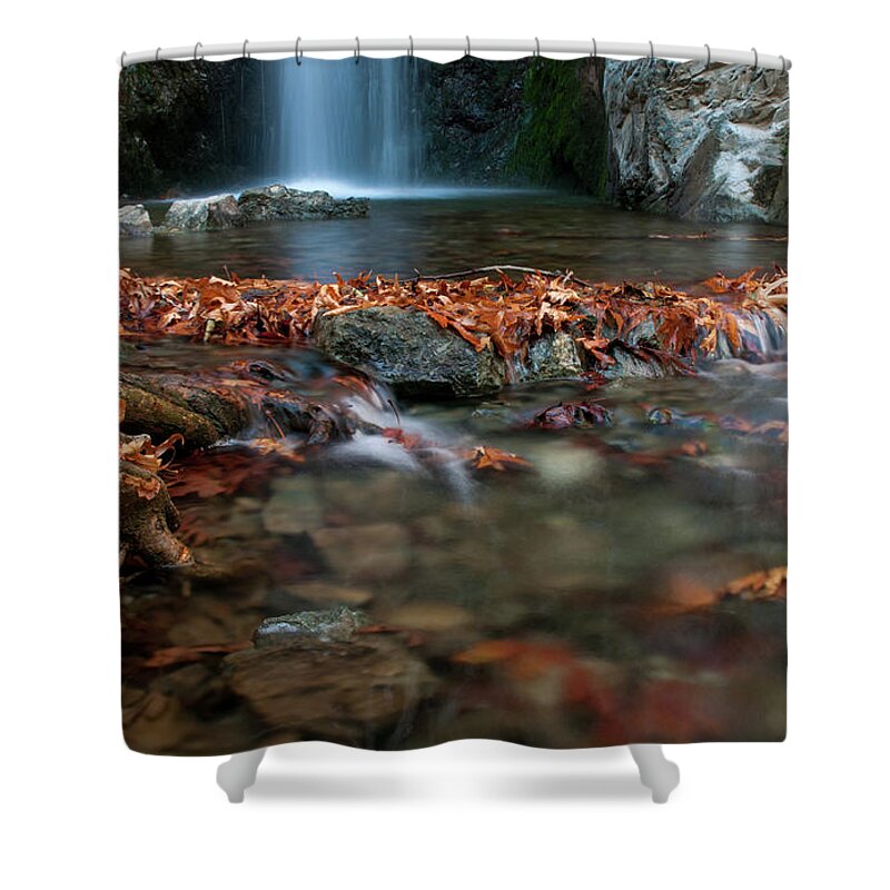 Troodos Shower Curtain featuring the photograph Waterfall and river flowing with maple leaves on the rocks on the river in Autumn by Michalakis Ppalis