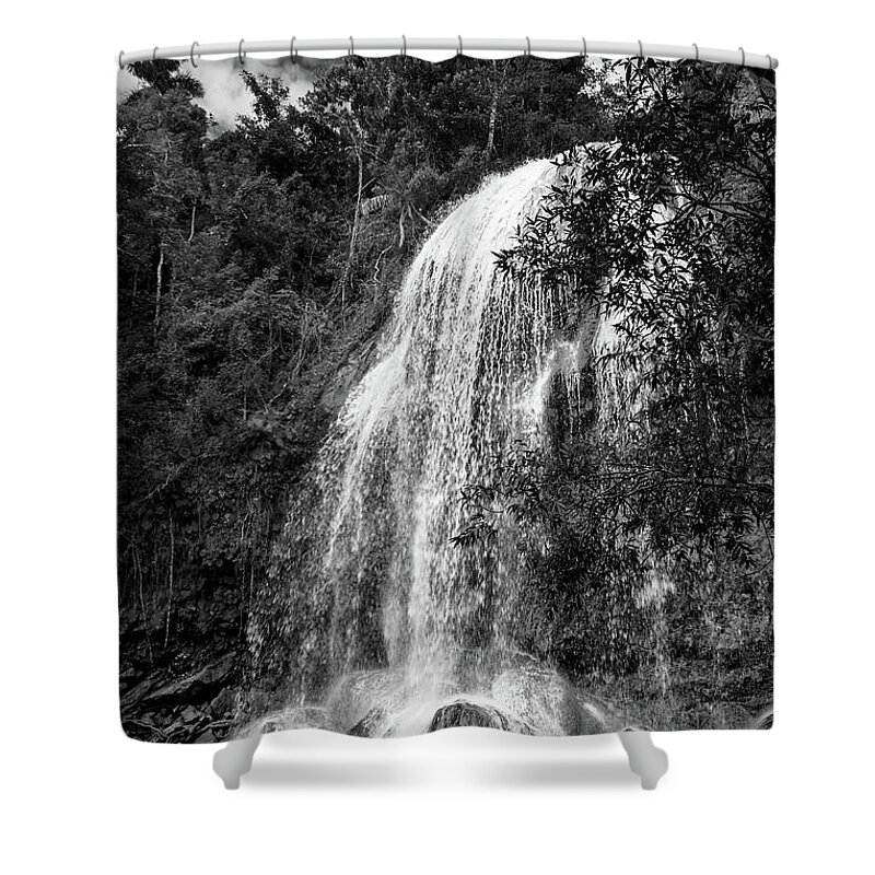 Soroa Shower Curtain featuring the photograph Waterfall on a tropical forest in Cuba. Vertical black and white image by Karel Miragaya