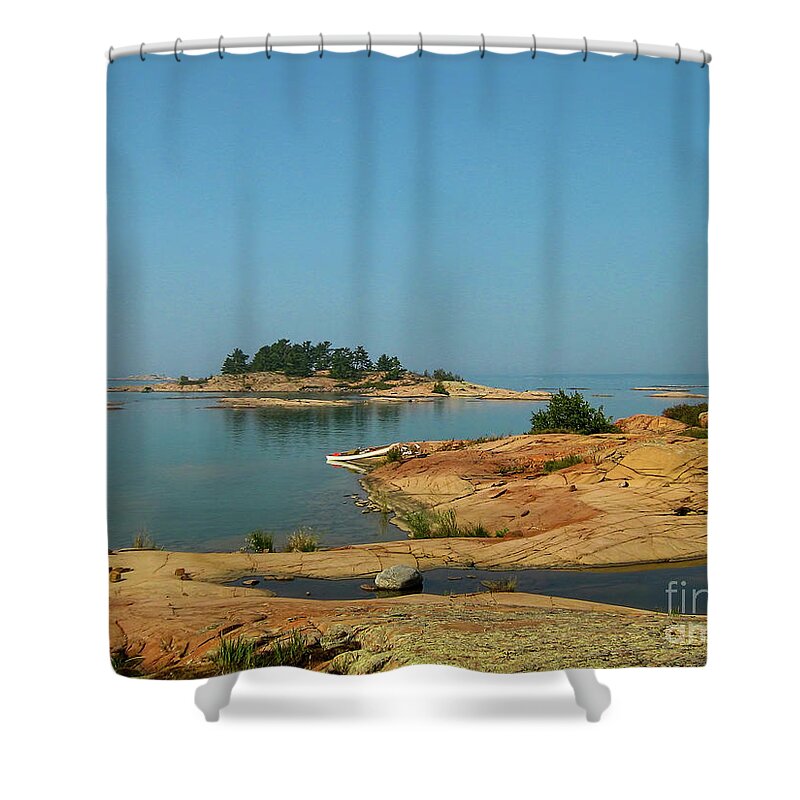 White Shower Curtain featuring the photograph White canoe on the shore of Georgian Bay in Ontario by Les Palenik