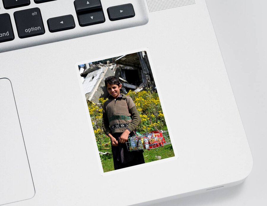 Boy Sticker featuring the photograph Pakistani boy in front of hotel ruins in Swat Valley by Imran Ahmed