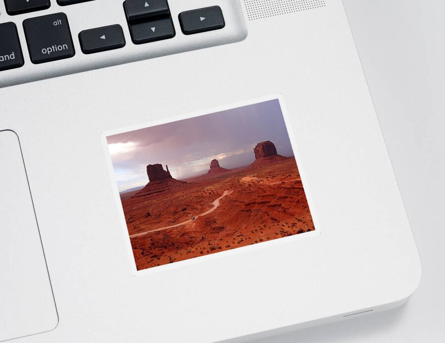 Monument Valley Sticker featuring the photograph Storms moving through Monument Valley by Keith Stokes