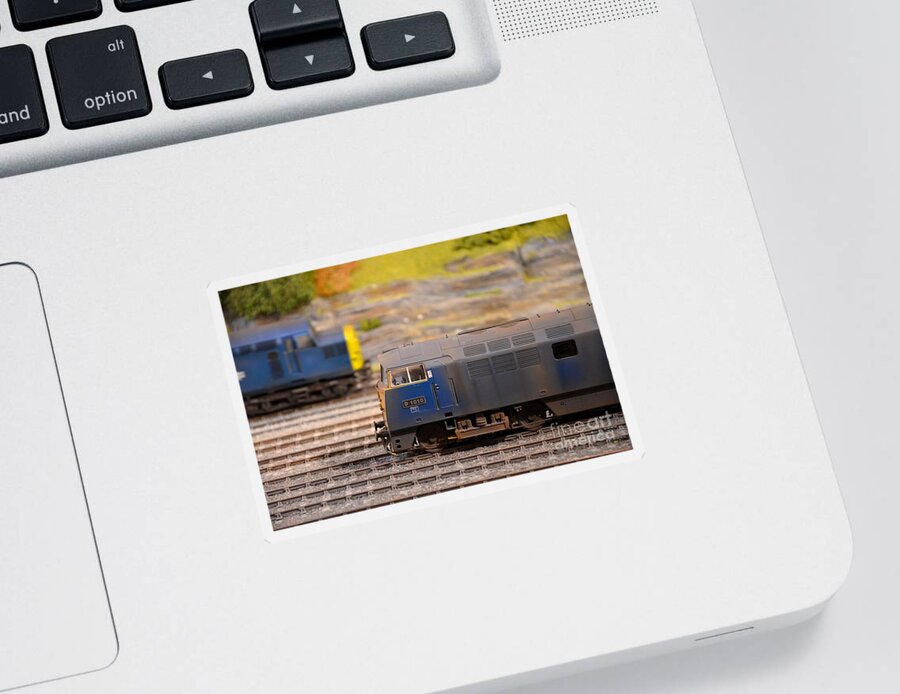 British Sticker featuring the photograph Two yellow blue British Rail model railway train engines by Imran Ahmed